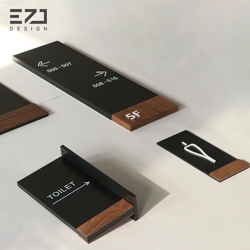 Coordinated black and wood-look directional and public-area signs