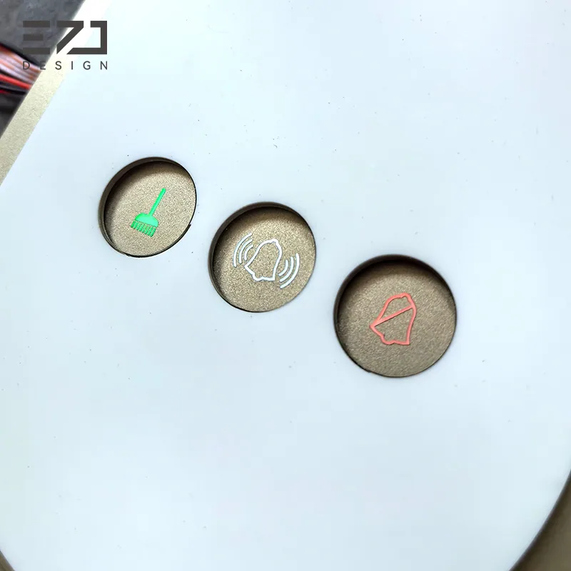 Close view of three status indicators on an oval electronic hotel door sign