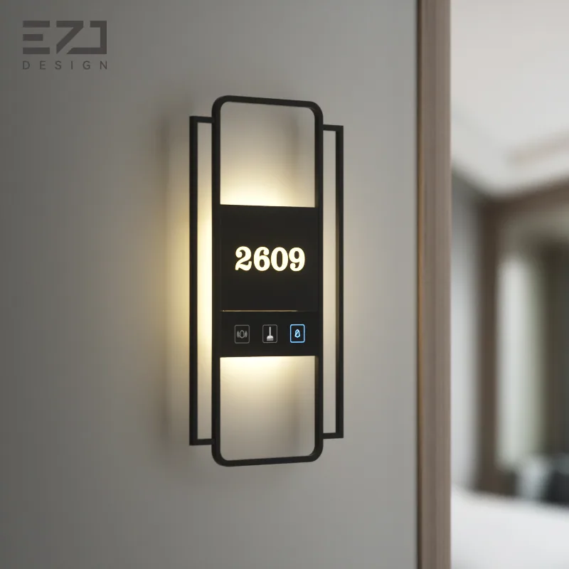 Geometric black electronic hotel door sign with illuminated room number